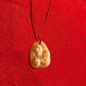 Hand-curved dog shape pendant